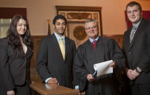 Ruth Dennehy '12 (L-R), Julian Delgado '14, Judge Joel Pisano '71, and Andrew Anastor '13