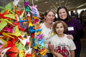 Susan Heard (left), David Heard, and Mary Jo Lodge, assistant professor of English, at a crane-stringing party held at Lafayette.