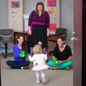 Heidi Tomik chooses her preferred play partner: Renee Gallo ’13 on the right (her FaceTime partner) or Rachel LeWitt ’13 on the left (a stranger). Professor Lauren Myers watches in the background.