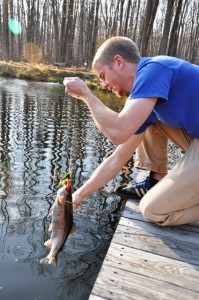 Benjamin Drake '14 pulls a catch out of the water.