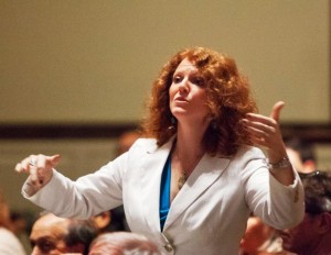 Jennifer Kelly, assistant professor of music and director of choral activities, conducts the Concert Choir during a performance.