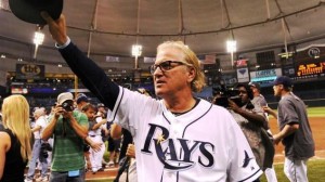 Joe Maddon '76 on the baseball field as media photograph and video him