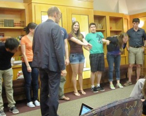 Students stretch and warm up during the performance.