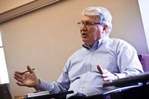 Professor David Johnson speaks while seated