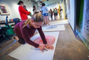 Madison Murray ’16 prepares a piece for framing.