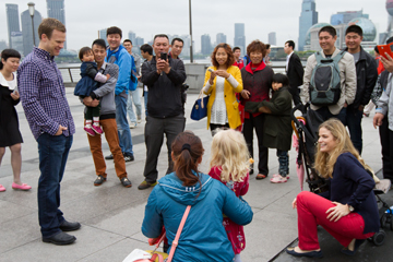 Kirk and Lauren Kjeldsen with their children at The Bund, Shanghai’s landmark riverfront promenade. Behind them across the Huangpu River is The Oriental Pearl Radio & TV Tower, one of the tallest structures in China. 