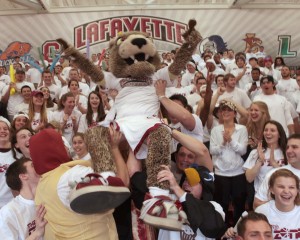 Basketball fans hold up the Lafayette Leopard as they cheer during the Bucknell game.