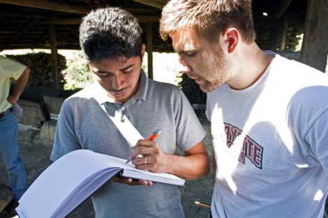 Luke Calvano ’12 speaks with a villager.
