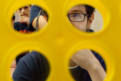 Erik Max Jones '15 looks through the Connect Four board.