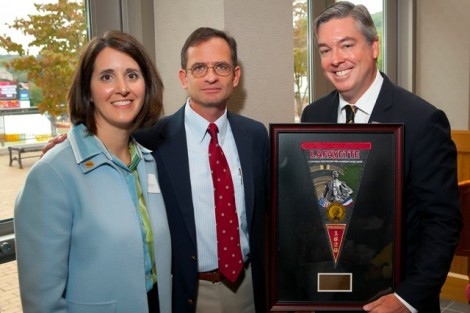Pamela Gaary Holran ’88, left, president of the Alumni Association, and President Daniel H. Weiss present John A. Fry '82 with the Kidd Award.