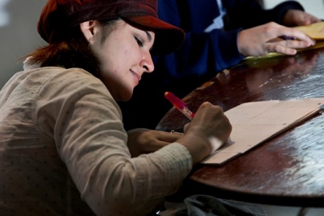 Rachael Richtberg '13 jots down an idea.