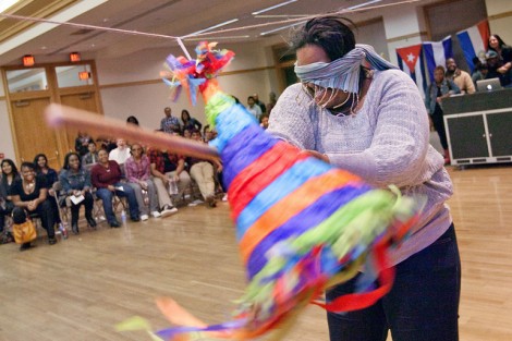 Breyon Brown '12 hits the piñata.