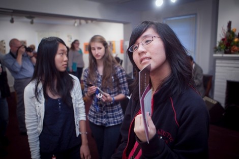 Gina Pan '15, right, explores the exhibit.