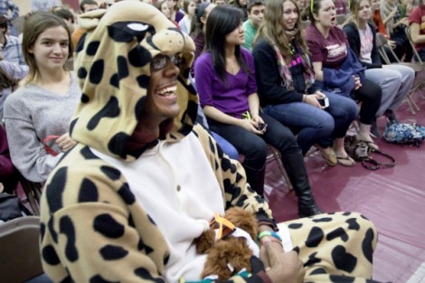 Leopard Christopher Trowell '13 and other students laugh during the show.