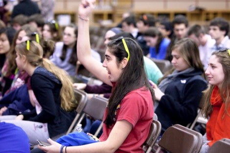 Rachel  Baer '14 cheers on a friend during the  wing-eating competition.