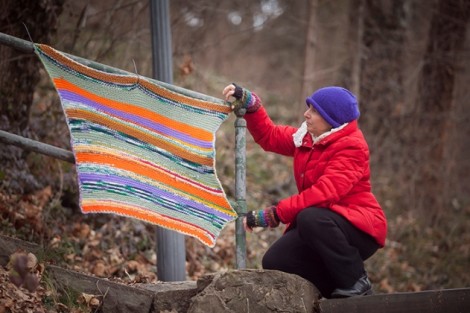 Easton resident Gail Sorkan attaches an afghan to the railing.