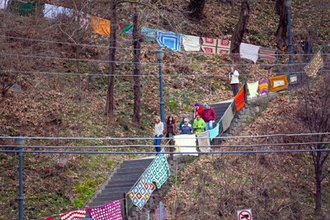 Afghans adorn the steps heading up the steps to campus.