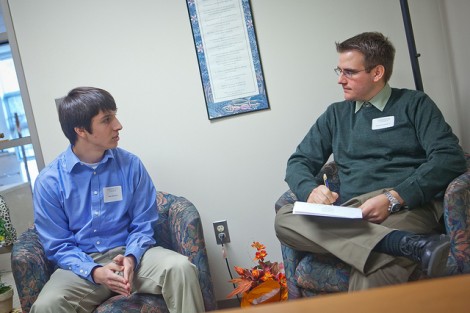 Frank Gianelli '07 (right) talks with a prospective student.