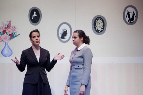 Julia Hobart ’15 (as K.C. Downing), left, is given instructions on how to be funny by Grace Marchena ’15 (as Alice Miller).