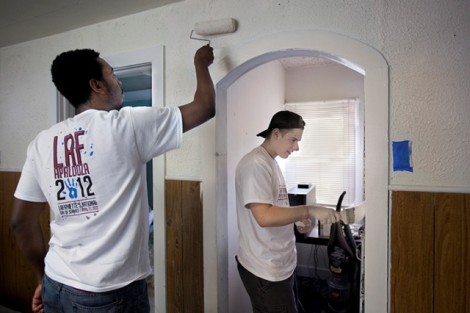 Brandon Laing '13, left, and Matt McKenzie '14 paint at Easton Area Neighborhood Center.