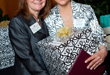 Marie Enea, assistant to the president, left, with Rochelle Lam, who is retiring as manager of student accounts in business affairs