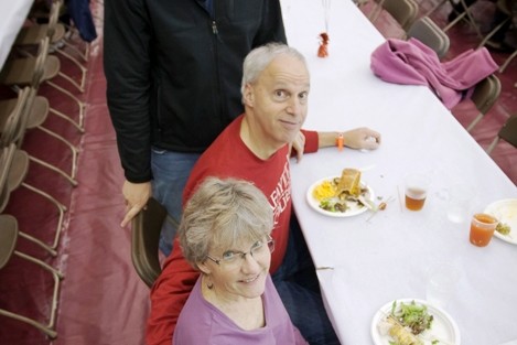 Sue and Steve Root share a meal with their son David Root '15.