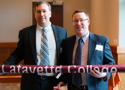 Scott Harris '95 (left) accepts Chapter of the Year Award for Atlanta Chapter; Michael DeLisi '03 named Chapter Support Person of the Year.