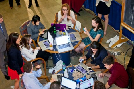 Students check online for potential on-air content prior to the broadcast.