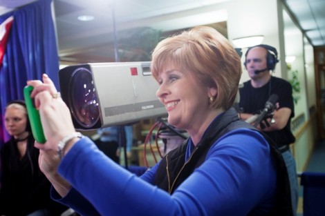 Amy Burkett, station manager for PBS Channel 39, takes cell phone photos to post on the station’s Facebook page.