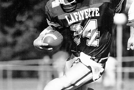 Erik Marsh ’95 carries the ball.
