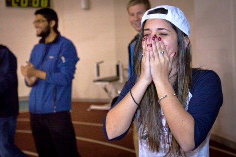 Jaime Getto '13 reacts after winning a flat screen TV by hitting the target at the far end of Kamine Gym during the Toss the Hawk contest.