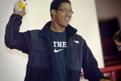 Travis Nicholson ’16 tries to hit targets in Kamine Gym during the Toss the Hawk contest.