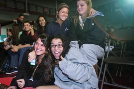 Students cheer during the wing-eating contest.