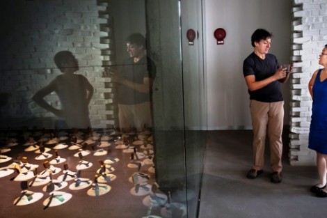 Nestor Armando Gil, left, assistant professor of art, speaks with Michiko Okaya, director of Lafayette Art Galleries.