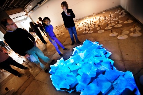 Students enjoy the reception for art professor Nestor Gil's Pan/Myopia exhibition.