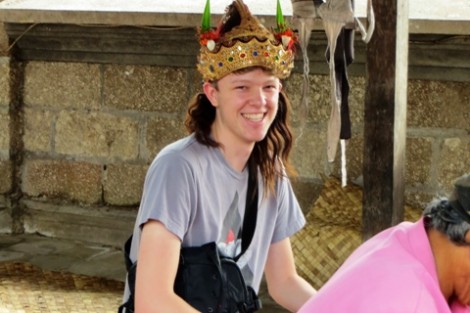Willem Ytsma '16 tries out a headpiece from a Barong theater production.