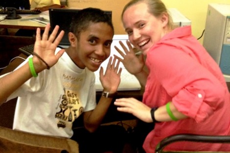 Lucy Bass ’14 works on the common app with a LIME student.