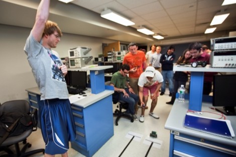 Rob Lowery '16 reacts as his robot wins a race.