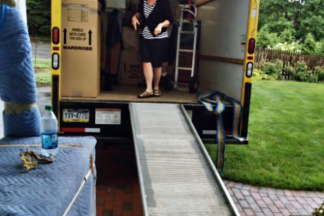On her first offical day, Alison Byerly helps unload the moving truck.