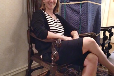 President Alison Byerly takes a short break from moving into the President's House.