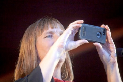 President Alison Byerly takes a photo of the audience to post to her Twitter feed.