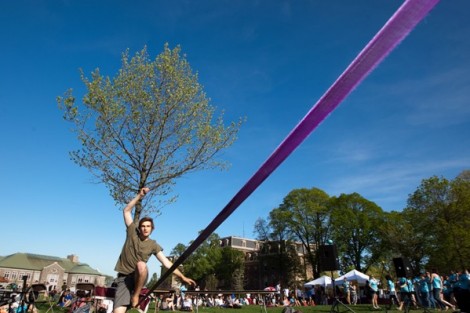 Eric Giovannetti '15 walks a slack line during the Jamesty celebration.