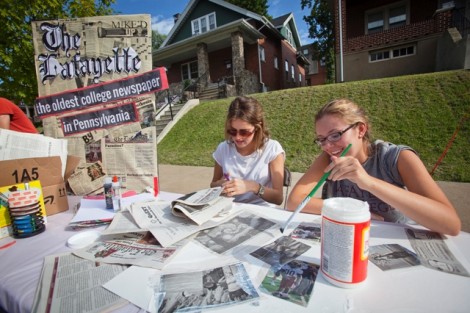 Members of The Lafayette newspaper staff make a collage.