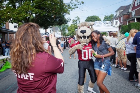 The Leopard hangs out with students during the Block pARTy.