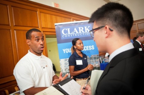 Keon West ’06 of Clark Construction speaks with a student.