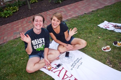 Students put their commemorative inauguration beach towel to good use during the dessert social in Anderson Courtyard.