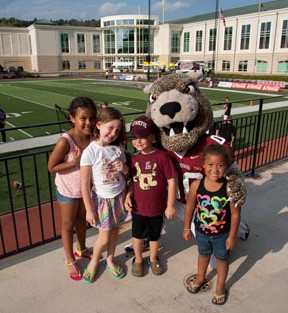 Gabrielle McFadden, 6 (L-R); Maggie LaBella, 6; Philip LaBella, 4; and Payton McFadden, 4, with the Leopard. 