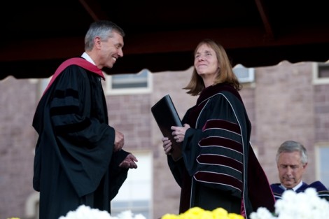 Stephen Pryor ’71, vice chair of the board, presents President Alison Byerly with a copy of The Charter and Statues of the College as a symbol of her presidential authority.