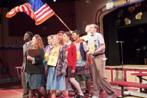 The cast performs a number.