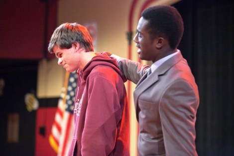 An audience volunteer is consoled by Marcus Vilmé ’17 as 'Official Comfort Counselor' Mitch Mahoney